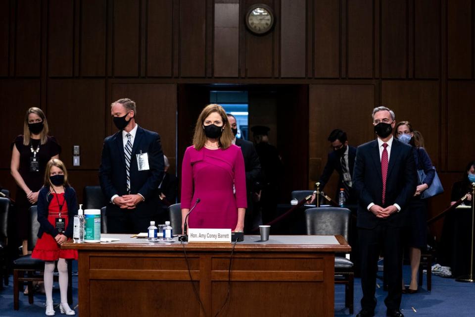 Judge Amy Coney Barrett stands with her family after her Senate Judiciary Committee confirmation hearing on Capitol Hill in Washington, Monday, Oct. 12, 2020.