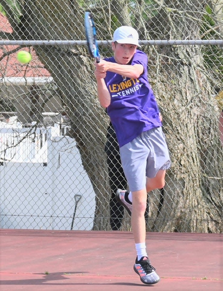 Lexington's Owen Gongwer returns a serve during Monday's district semifinal match with Ontario.