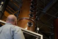 Herman Mihalich looks at the distillation column where his rye whisky is made in his distillery in Bristol Pennsylvania