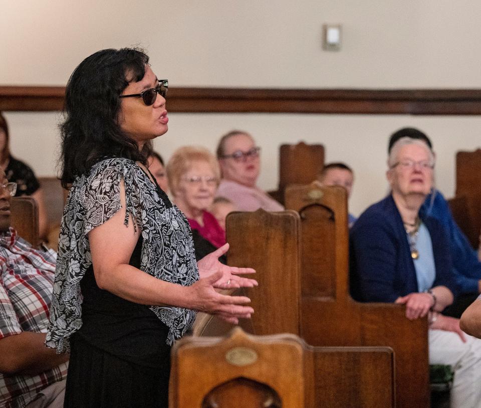 Sheila Jackson speaks about her memories at Summerfield United Methodist Church during its final gathering Sunday, June 25. The church had a rich history and an outsized impact on its neighborhood.