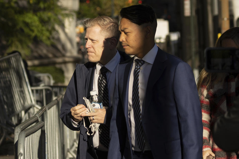 Actor Anthony Rapp, left, arrives at court for the civil lawsuit trial against Kevin Spacey, Thursday, Oct 6, 2022, in New York. Spacey is heading to court to defend himself in a lawsuit filed by Rapp, the actor who was the first in a string of people to publicly accuse the “House of Cards” star of sexual misconduct. (AP Photo/Yuki Iwamura)