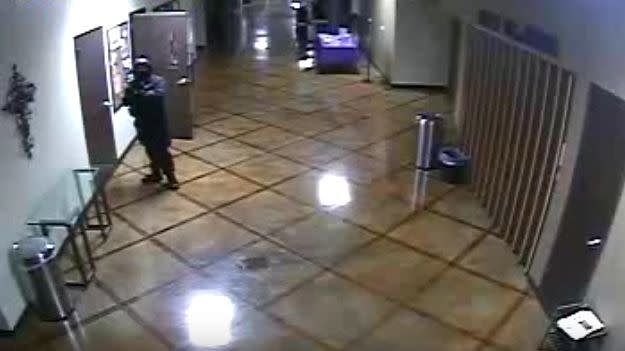 The man can be seen lurking in the hallway only moments before the murder took place. Photo: MTPD