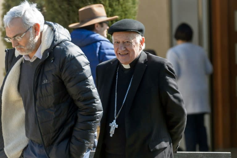 Archbishop Ricardo Ezzati (R) is pictured as he leaves a convention center near Santiago, after holding a meeting with members of the Chilean Episcopal Conference, on August 03, 2018