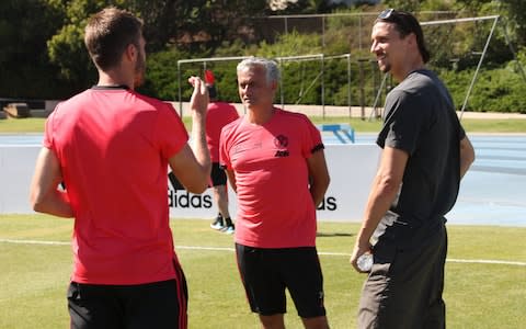 Zlatan Ibrahimovic (right) stops by Man Utd training - Credit: getty images