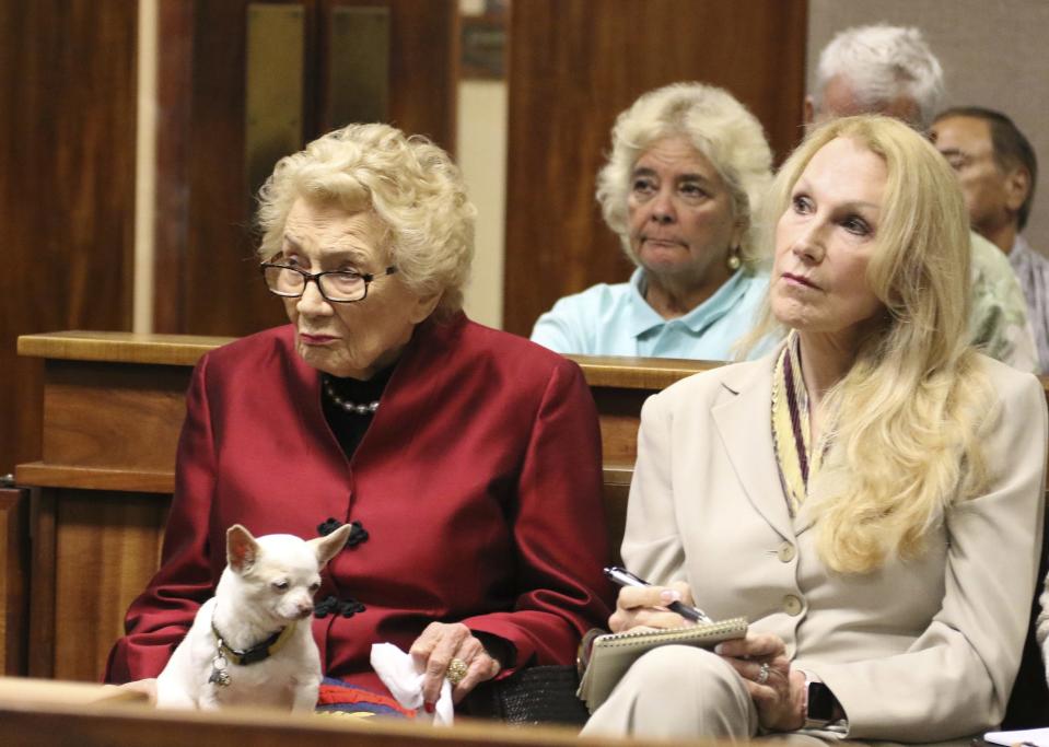 Native Hawaiian heiress Abigail Kawananakoa, left, sits next to her wife, Veronica Gail Worth, during a court hearing in Honolulu on Friday.