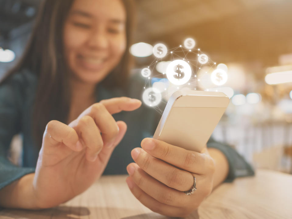 Asian woman hand using mobile phone with online transaction application, Concept financial technology (fin-tech)