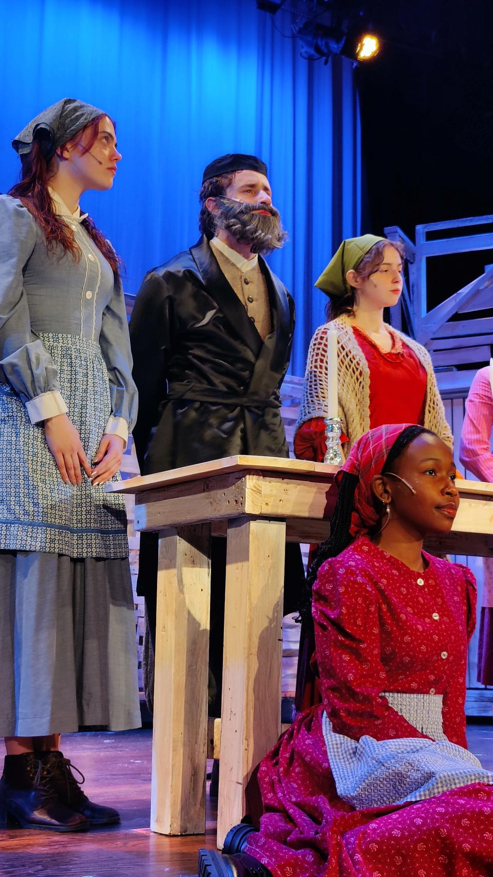 The cast of Dobbs Ferry High School's production of "Fiddler on the Roof" includes, from left: Eve Bolger as Tzeitel, Anthony Palumbo as Tevye, Anna Schriever as Golde and, seated, 
Heidi Gastorn as Bielke. Performances at 7 p.m., April 12; 1 and 7 p.m., April 13.