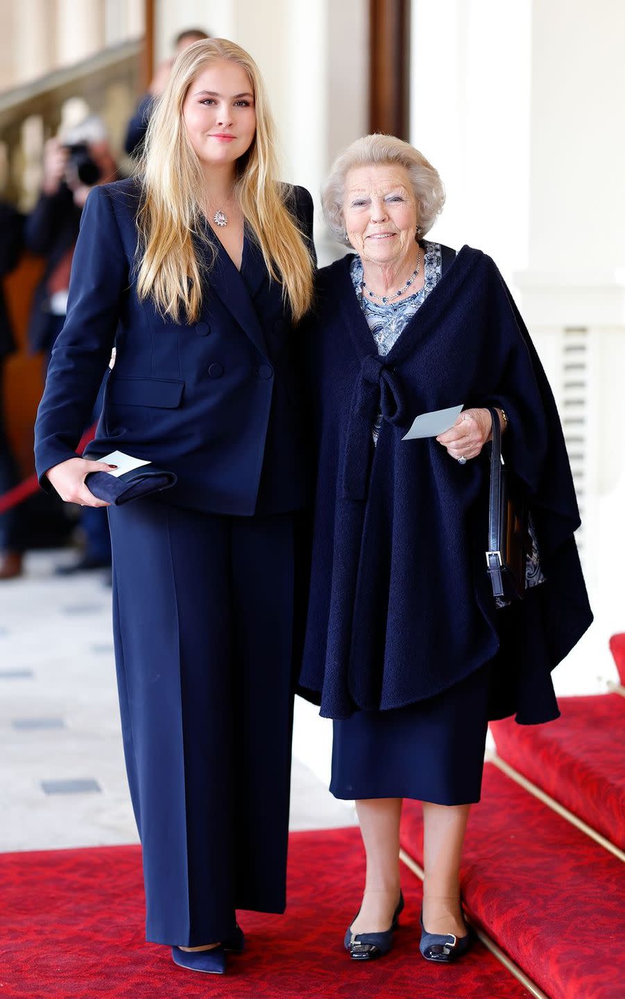 a couple of women in blue dresses