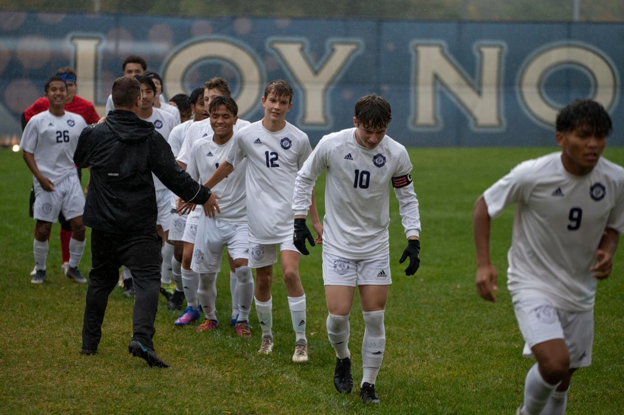 The Lakeview High School soccer team take the field for a game at Loy Norrix High School on Wednesday, Oct. 12, 2022.