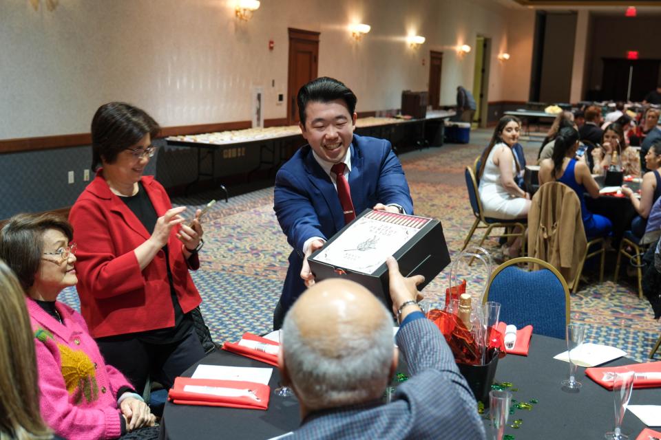 A TTUHSC medical student receives his assignment from a family member at the 2023 Match Day, held in downtown Amarillo.