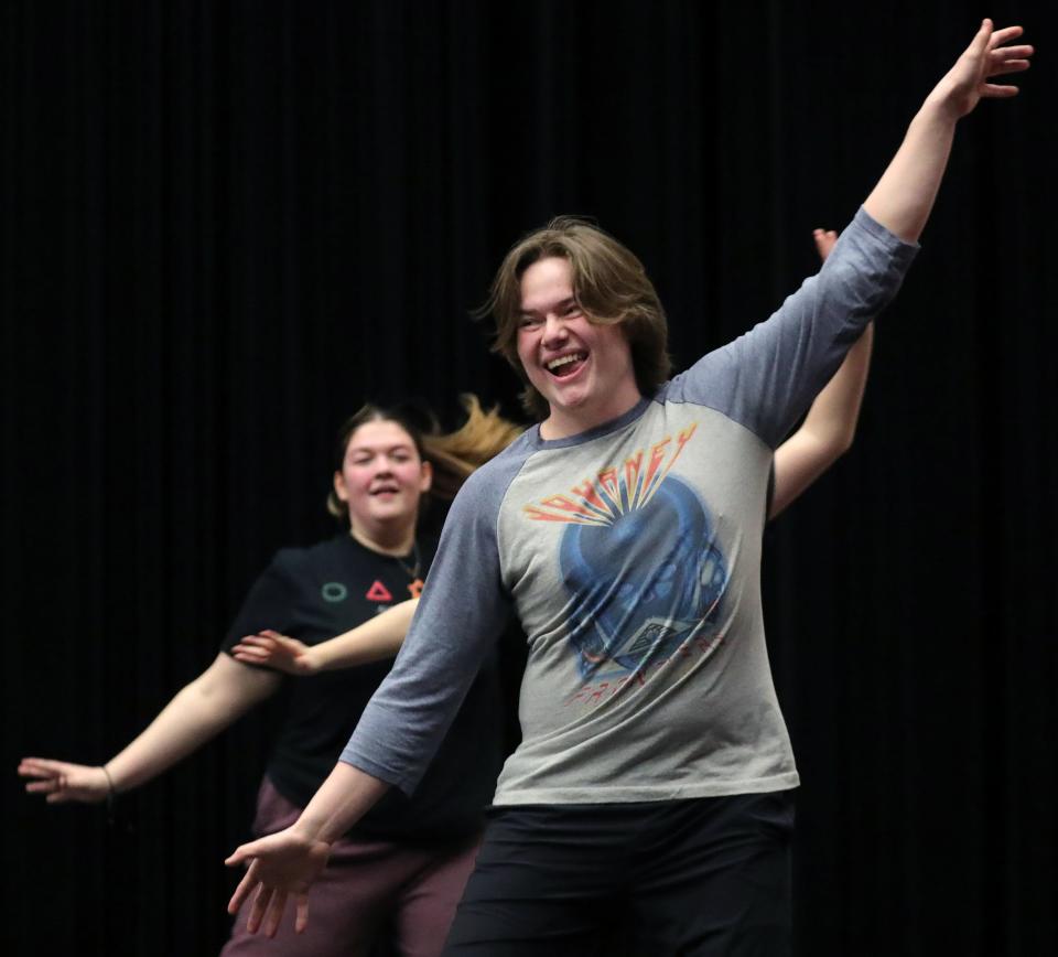 Kyle McFalls, playing the role of Jesse, practices a dance routine during rehearsal for "Tuck Everlasting" at Firestone high school.