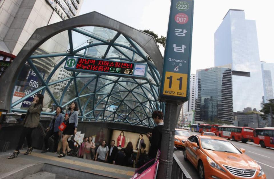 People come out at Gangnam subway station in the Gangnam area of Seoul.