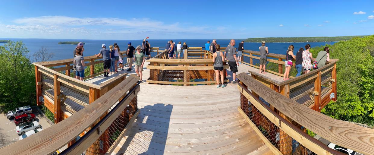 People take in the views from Peninsula State Park's Eagle Tower in Door County on May 22, 2021.