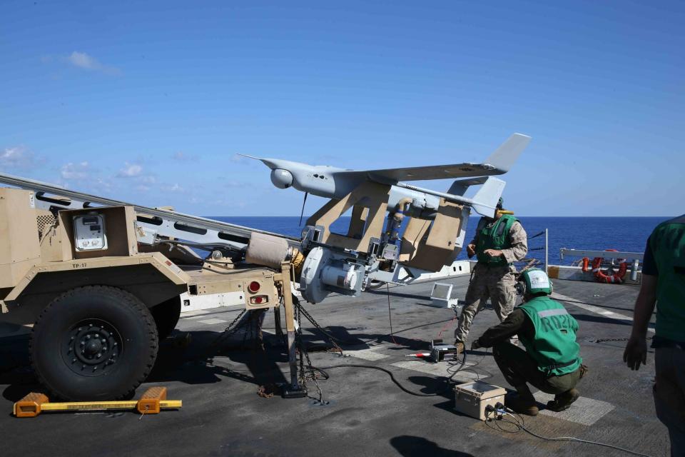 Marines attached to the 15th Marine Expeditionary Unit’s (15th MEU) Unmanned Aerial Surveillance unit launch an RQ-21A Blackjack small tactical unmanned aircraft system aboard the <em>San Antonio</em> class amphibious transport dock ship USS <em>San Diego</em> (LPD-22), September 26, 2017. <em>U.S. Marine Corps photo by Lance Cpl. Jeremy Laboy/Released</em>