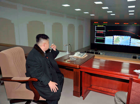 FILE PHOTO: North Korean leader Kim Jong-Un smokes a cigarette at the General Satellite Control and Command Center after the launch of the Unha-3 (Milky Way 3) rocket carrying the second version of Kwangmyongsong-3 satellite at West Sea Satellite Launch Site in Cholsan county, North Pyongan province December 12, 2012, in this picture released by the North's KCNA news agency in Pyongyang December 13, 2012. KCNA/via REUTERS/File Picture