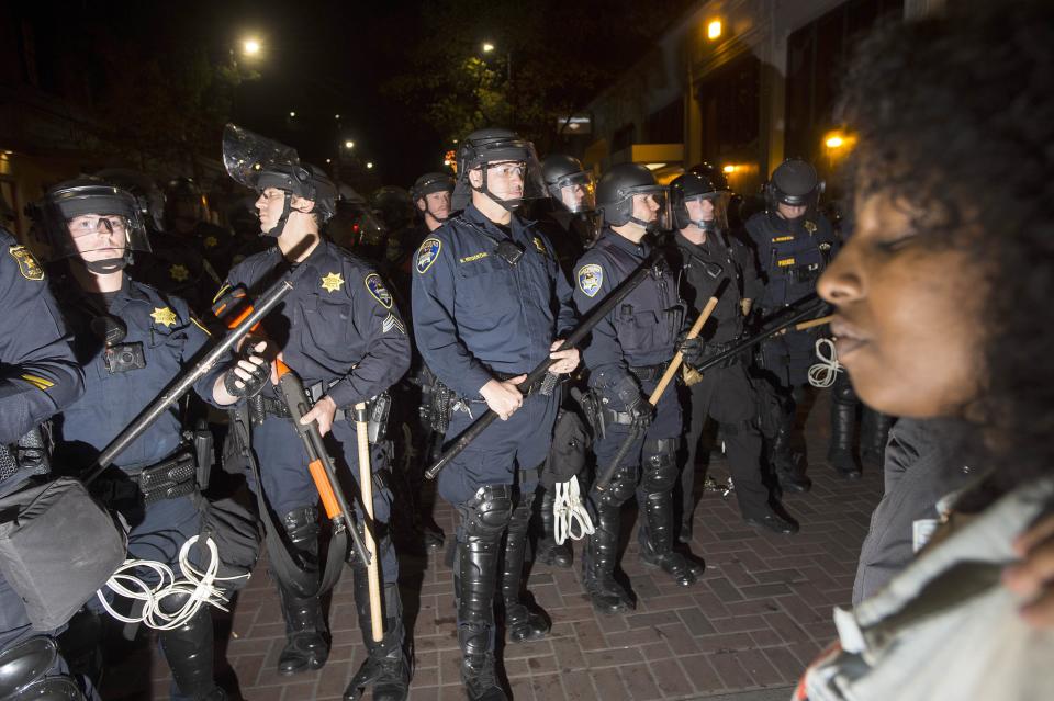 Police officers square off against protesters during a protest against police violence in the U.S., in Berkeley, California