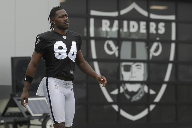 Oakland Raiders receiver Antonio Brown decides on a helmet