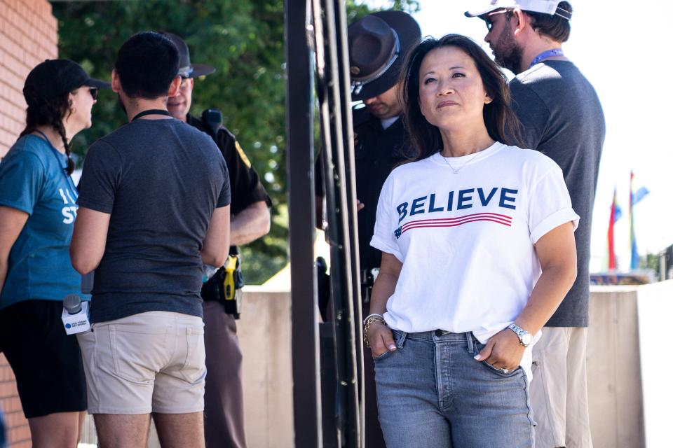 GOP presidential candidate Ryan Binkley's wife Ellie watches as he speaks at the Des Moines Register Political Soapbox during day three of the Iowa State Fair on Saturday, August 12, 2023 in Des Moines.
