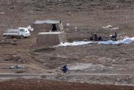 Syrian refugees, who fled the violence from their country, build a tent in preparation for a storm at the Lebanese border town of Arsal, in the eastern Bekaa Valley December 10, 2013. The Social Affairs Ministry announced Tuesday that it started to execute a plan for helping the displaced Syrians in Lebanon amidst the snow storm expected to strike Lebanon today evening, the National News Agency (NNA) reported. REUTERS/Mohamed Azakir (LEBANON - Tags: POLITICS CIVIL UNREST SOCIETY IMMIGRATION CONFLICT)