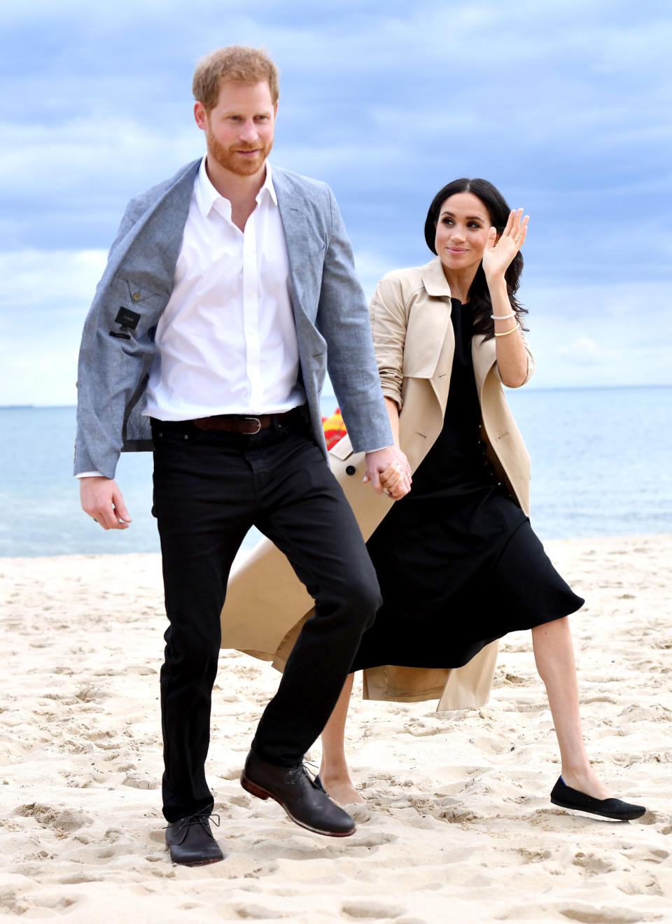 <p>She changed into a black dress and flats for an afternoon visit to a Melbourne beach. Photo: REX </p>