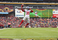 <p>Free safety Curtis Riley #35 of the New York Giants jumps into the end zone for a touchdown after an interception in the first quarter against the Washington RedskinsFedExField on December 9, 2018 in Landover, Maryland. (Photo by Patrick Smith/Getty Images) </p>