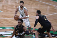 Boston Celtics forward Jayson Tatum (0) looks to pass the ball against the Cleveland Cavaliers during the first half of Game 1 of an NBA basketball second-round playoff series Tuesday, May 7, 2024, in Boston. (AP Photo/Charles Krupa)