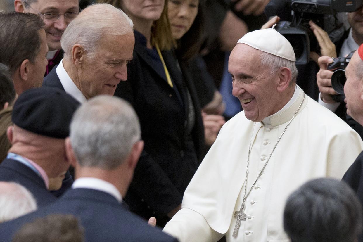 In this April 29, 2016 photo Pope Francis shakes hands with then-Vice President Biden at the Vatican.