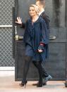 <p>Heading to the Tonight Show With Jimmy Fallon, Robbie looked super chic in a navy smock dress, paired with tights and black heels.</p>