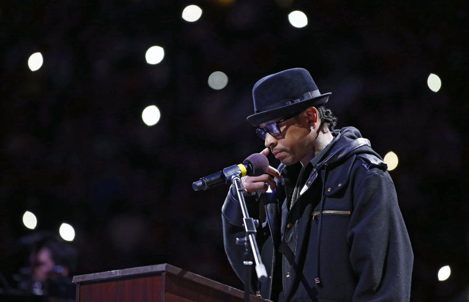 Former Philadelphia 76ers' Allen Iverson pauses while speaking during his retirement ceremony at half-time of an NBA basketball game between the Philadelphia 76ers and the Washington Wizards, Saturday, March 1, 2014, in Philadelphia. (AP Photo/Matt Slocum)