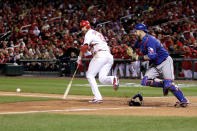 ST LOUIS, MO - OCTOBER 19: Chris Carpenter #29 of the St. Louis Cardinals strikes out bunting foul as catcher Mike Napoli #25 of the Texas Rangers goes for the play during Game One of the MLB World Series at Busch Stadium on October 19, 2011 in St Louis, Missouri. (Photo by Rob Carr/Getty Images)