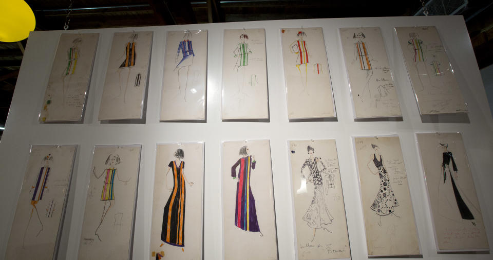 This Monday, Dec. 30, 2013, photo shows several of the Karl Lagerfeld drawings that will be auctioned in West Palm Beach, Fla. A 50-year-old archive of some of Lagerfeld’s early fashion designs is going up for auction in Florida. In the 1960s, Lagerfeld was designing for Elizabeth Taylor and other celebrities while working for the House of Tiziani in Rome. (AP Photo/J Pat Carter)