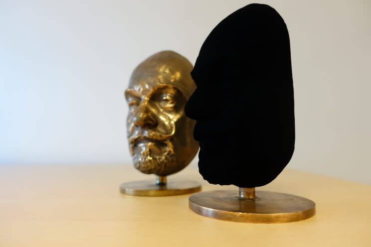 A bust covered in Vantablack compared to the original bust. Photo from Surrey NanoSystems