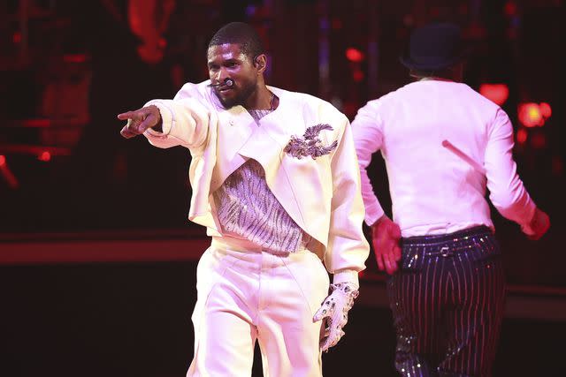 <p>Steph Chambers/Getty</p> Usher performing at the Super Bowl