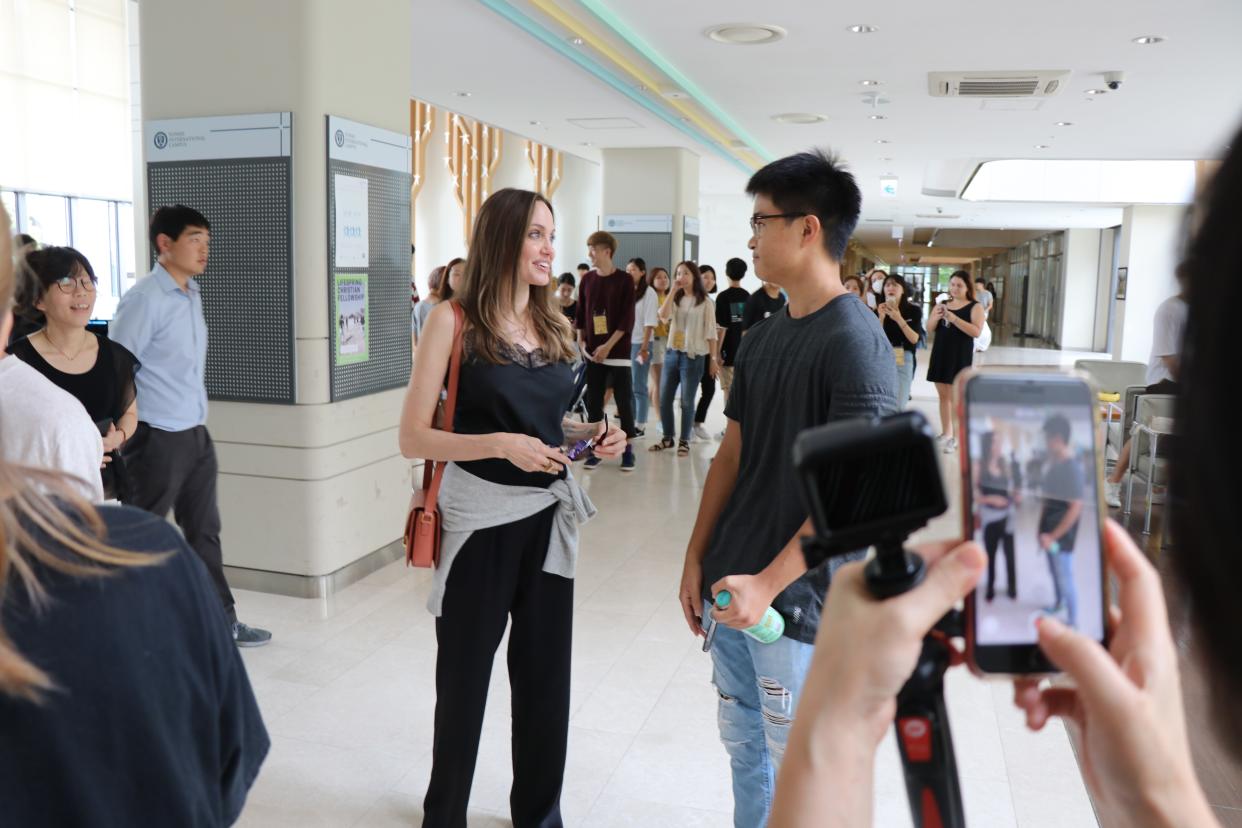 Angelina Jolie speaks to a student at Yonsei University in Seoul, South Korea. She was there to drop off her son Maddox. Photo: Mega