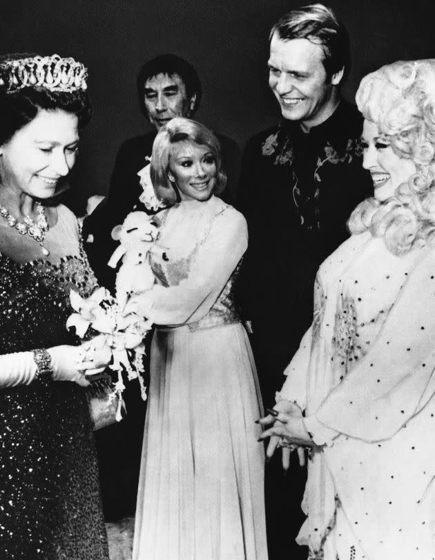 Queen Elizabeth II chats with Dolly Parton, the 