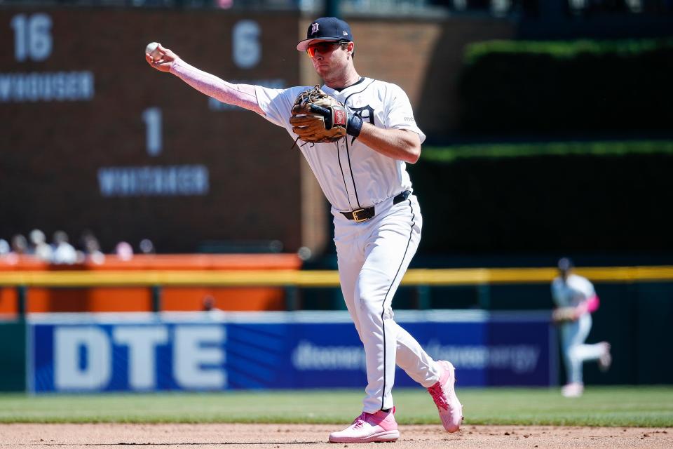 Detroit Tigers second base Colt Keith (33) throws towards first base Spencer Torkelson (20) against Houston Astros during the third inning at Comerica Park in Detroit on Sunday, May 12, 2024.