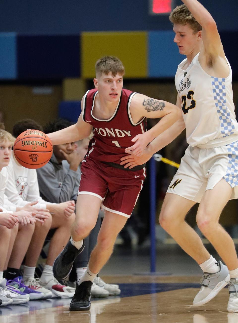 Stephen Schreiter, left, is third in scoring for the Fond du Lac basketball team this season.