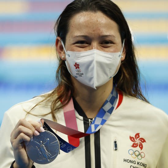 Silver medalist Siobhan Bernadette Haughey of Hong Kong, China who set an Asia record holds her medal at the Women