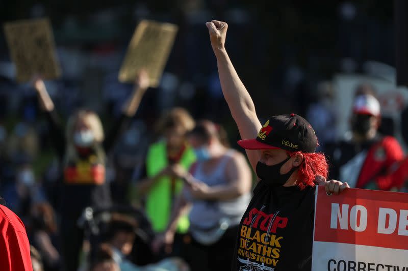 People demonstrate in solidarity with the Black Lives Matter (BLM) rallies in the United States, calling for an end to police brutality against Black people in the United States and First Nations people in Australia, in Sydney