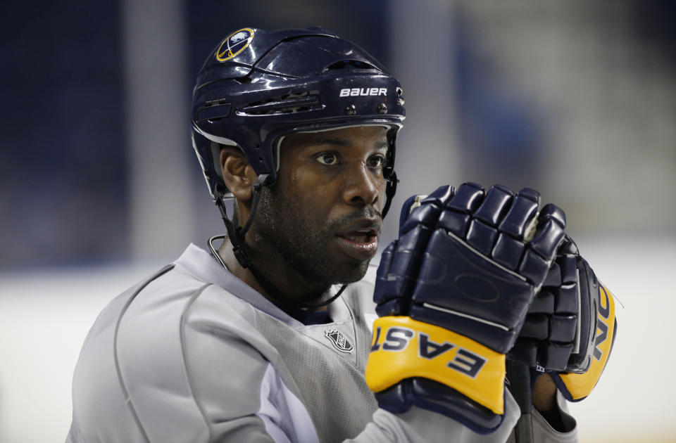 FILE - Buffalo Sabres' Michael Grier is shown during NHL hockey practice in Buffalo, N.Y., Tuesday, April 13, 2010. The San Jose Sharks have hired longtime NHL forward Mike Grier to become the first Black general manager in NHL history. Grier fills the spot that opened when Doug Wilson stepped away for health reasons earlier this year in a barrier-breaking move for the league on Tuesday, July 5, 2022. (AP Photo/David Duprey, File)