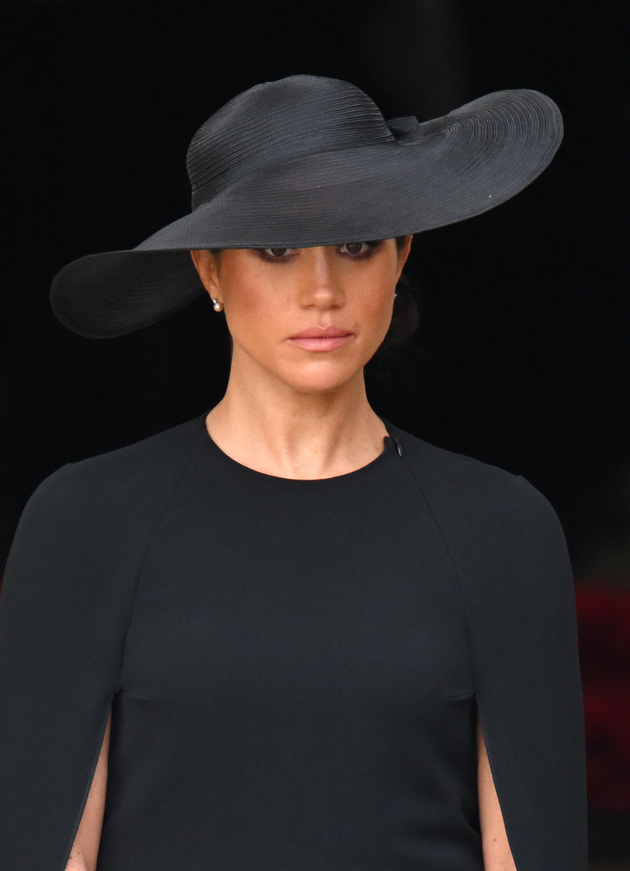 The Duchess of Sussex, wearing pearls gifted to her by Queen Elizabeth II, at Westminster Abbey. 