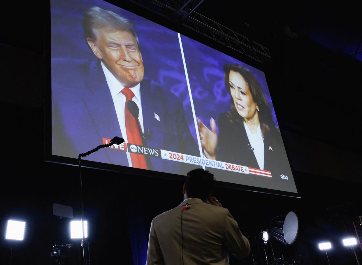 A screen displays the presidential debate hosted by ABC between Republican presidential nominee, former U.S. President Donald Trump and Democratic presidential nominee, U.S. Vice President Kamala Harris in Philadelphia, Pennsylvania as September 10, 2024.