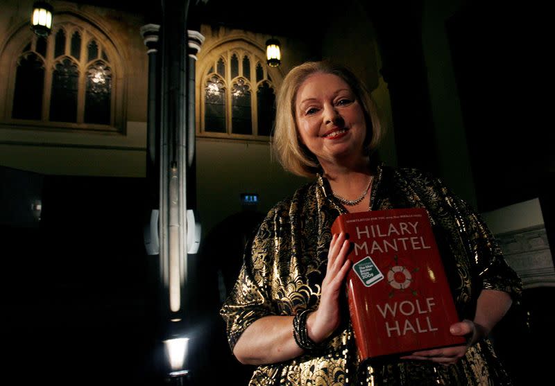 FILE PHOTO: Author Hilary Mantel poses with her book "Wolf Hall" after winning the 2009 Man Booker Prize for Fiction at the Guildhall in London