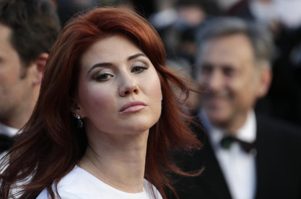 FILE - Russian Anna Chapman, who was deported from the U.S. in July 2010 on charges of espionage, poses for photographers as she arrives for the screening of Behind the Candelabra at the 66th international film festival, in Cannes, southern France, on May 21, 2013. Russia has a history of giving former agents their own TV shows. In 2011, Anna Chapman, a former Russian sleeper agent in the U.S. who was exchanged in the same spy swap as Sergei Skripal, was given her own TV show, “Chapman’s Secrets.” And in 2014, Andrei Lugovoi anchored the TV show ‘traitors,’ about Soviet spies who betrayed their motherland. Lugovoi is wanted in the UK over involvement in the death of former Russian spy Alexander Litvinenko who died in London in 2006 after being poisoned with tea laced with radioactive polonium-210. (AP Photo/David Azia)