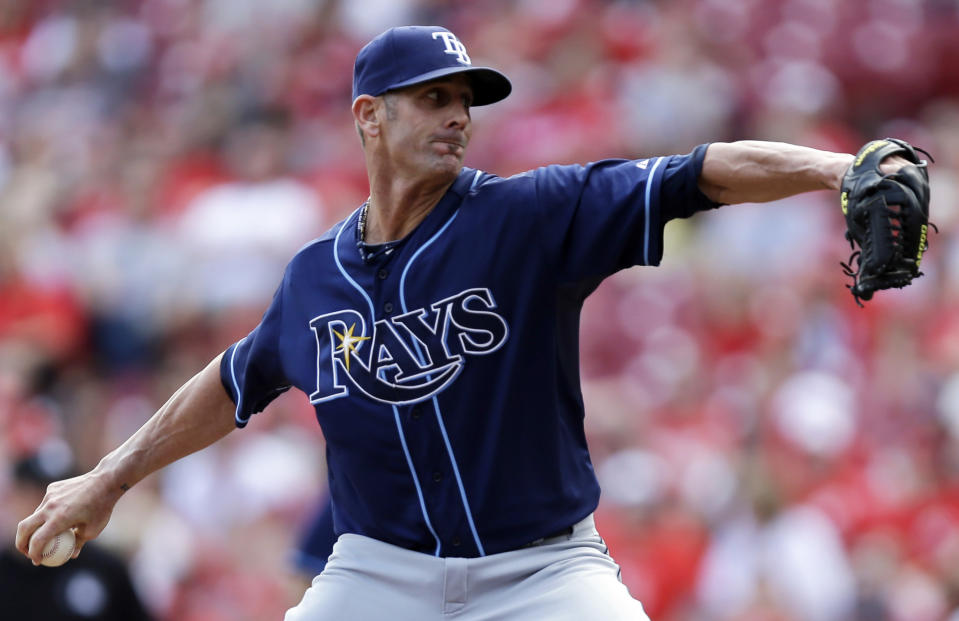 Tampa Bay Rays relief pitcher Grant Balfour throws against the Cincinnati Reds in the ninth inning of a baseball game, Saturday, April 12, 2014, in Cincinnati. Balfour earned his fourth save of the season as Tampa Bay won 1-0. (AP Photo/Al Behrman)