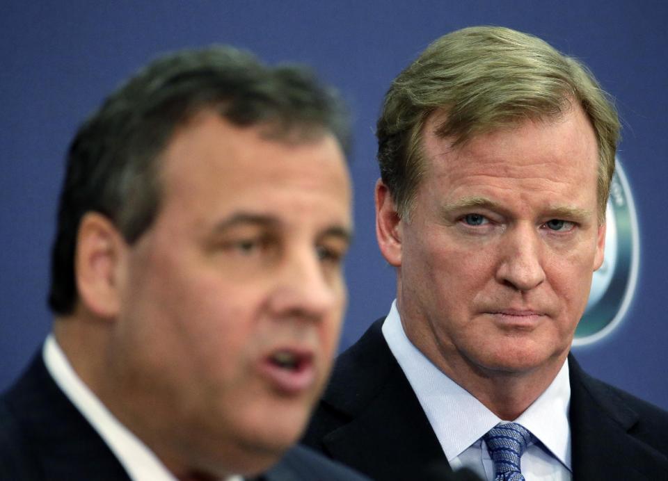 NFL commissioner Roger Goodell, right, listens to New Jersey Gov. Chris Christie speak at an NFL Foundation news conference Monday, Jan 27, 2014, in Newark, N.J. (AP Photo/Charlie Riedel)