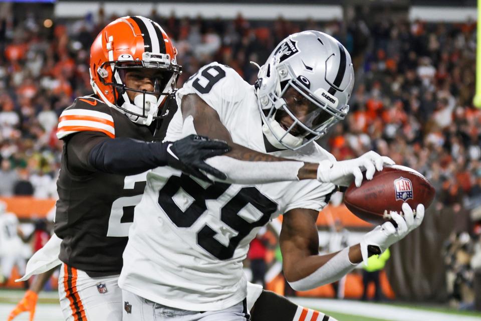 Las Vegas Raiders wide receiver Bryan Edwards (89) catches a 5-yard touchdown pass against Cleveland Browns cornerback Denzel Ward during Monday's NFL game in Cleveland.