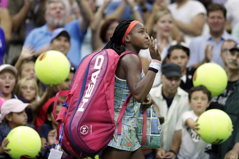 Coco Gauff, of the United States, waves as she walks off court after a loss to Naomi Osaka, of Japan, during the third round of the U.S. Open tennis tournament Saturday, Aug. 31, 2019, in New York. (AP Photo/Adam Hunger)