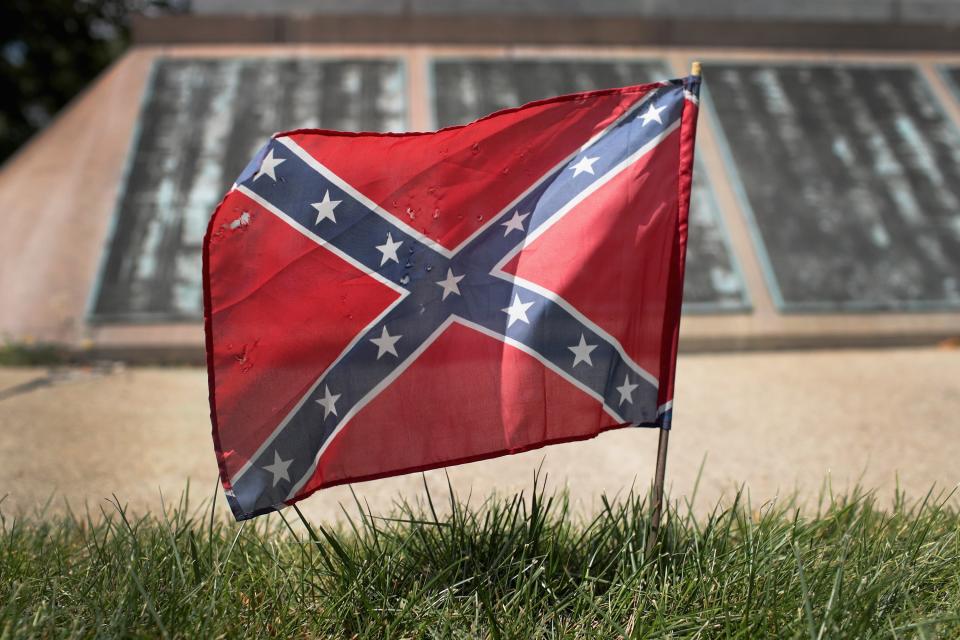 <p>Ruling referred to the flag as a ‘symbol inflaming the already strained relationship between the parties’ in custody battle</p> ( Scott Olson/Getty Images)