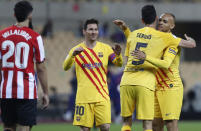 Barcelona players celebrate after winning the Spanish Copa del Rey final 2021 against Athletic Bilbao at La Cartuja stadium in Seville, Spain, Saturday April 17, 2021. (AP Photo/Angel Fernandez)